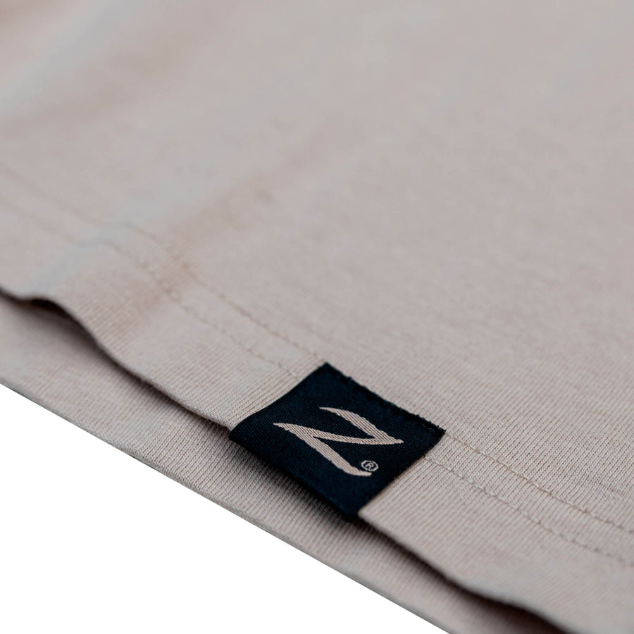 Close up detail of hem tag on the Zildjian Limited Edition ALCHEM-E Heavy Tee