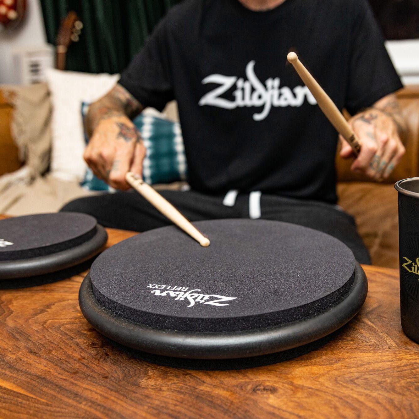 Man practicing on Black Zildjian Reflexx Condition pads