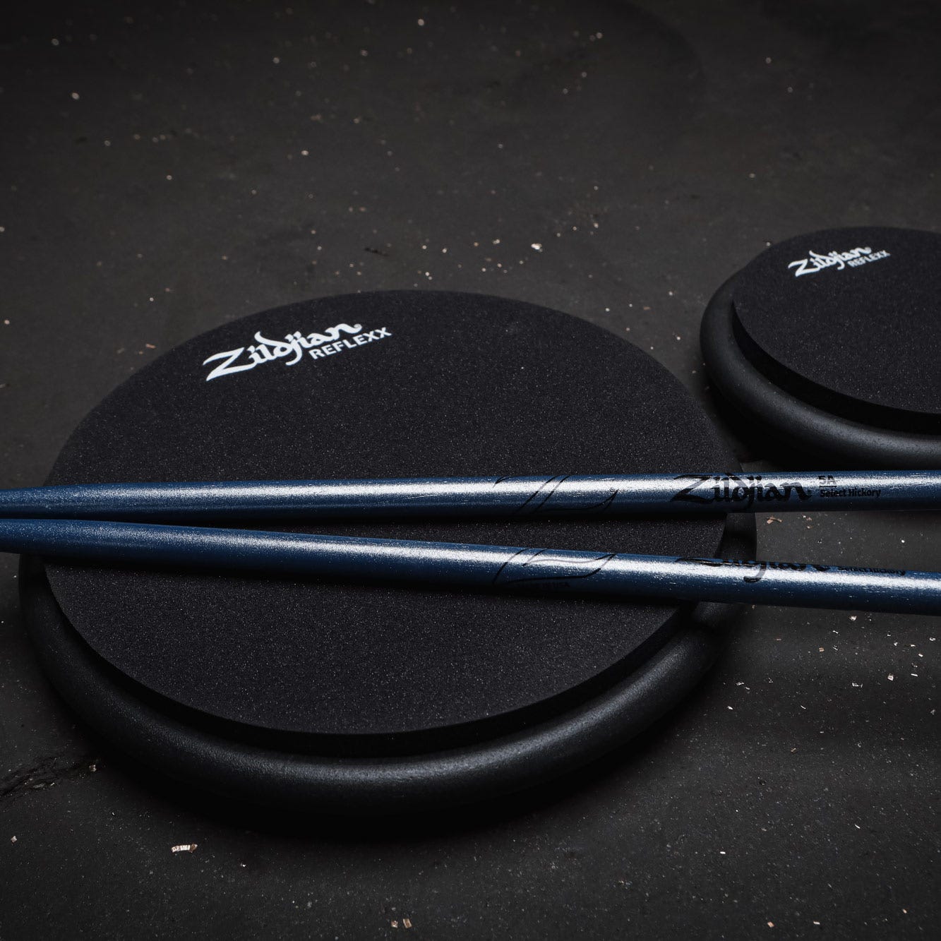 Shot of Black Reflexx pads with chroma Zildjian sticks