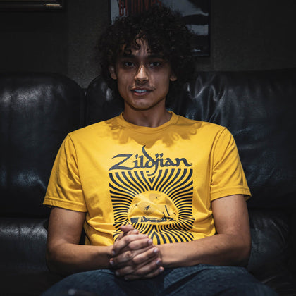 Model Wearing 400th Anniversary 60s Rock sitting down